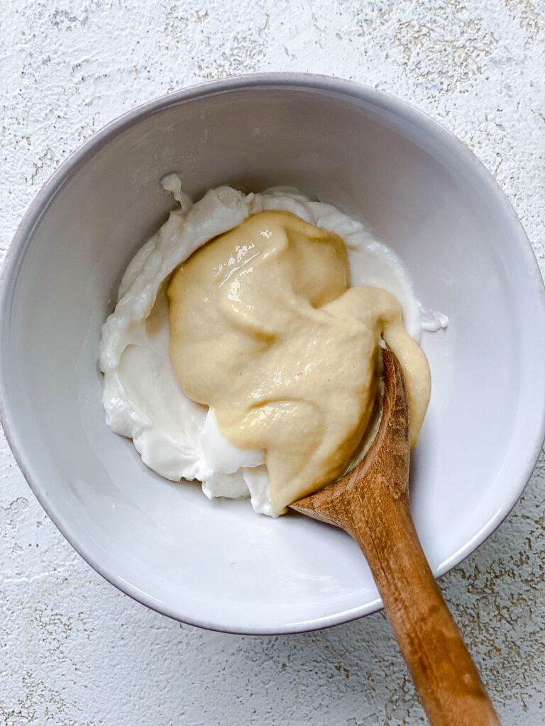 process shot of mixing coating together in bowl