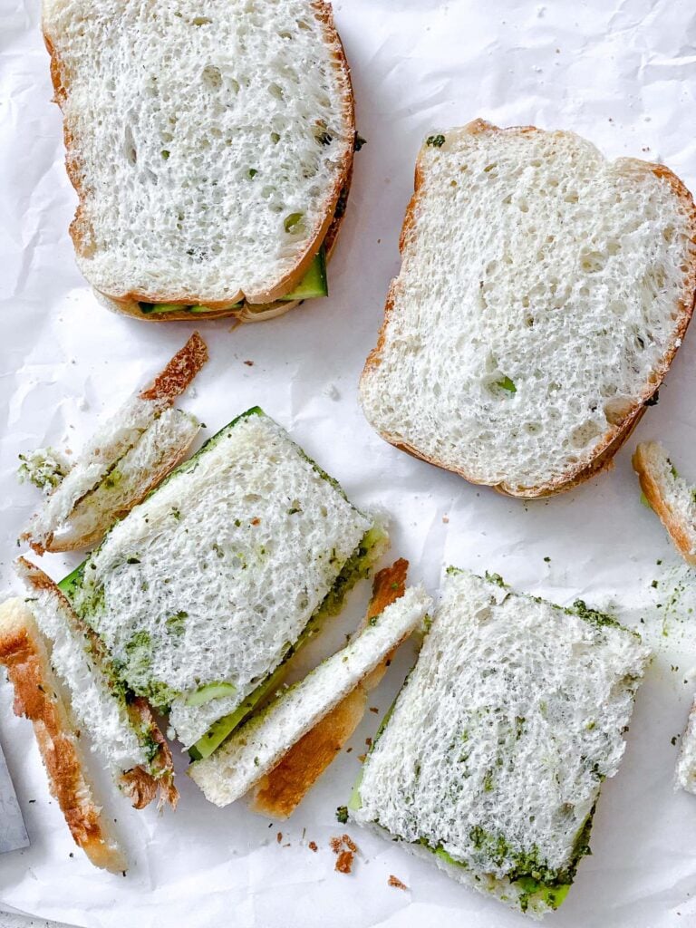 process shot showing slicing the crust from the sandwich