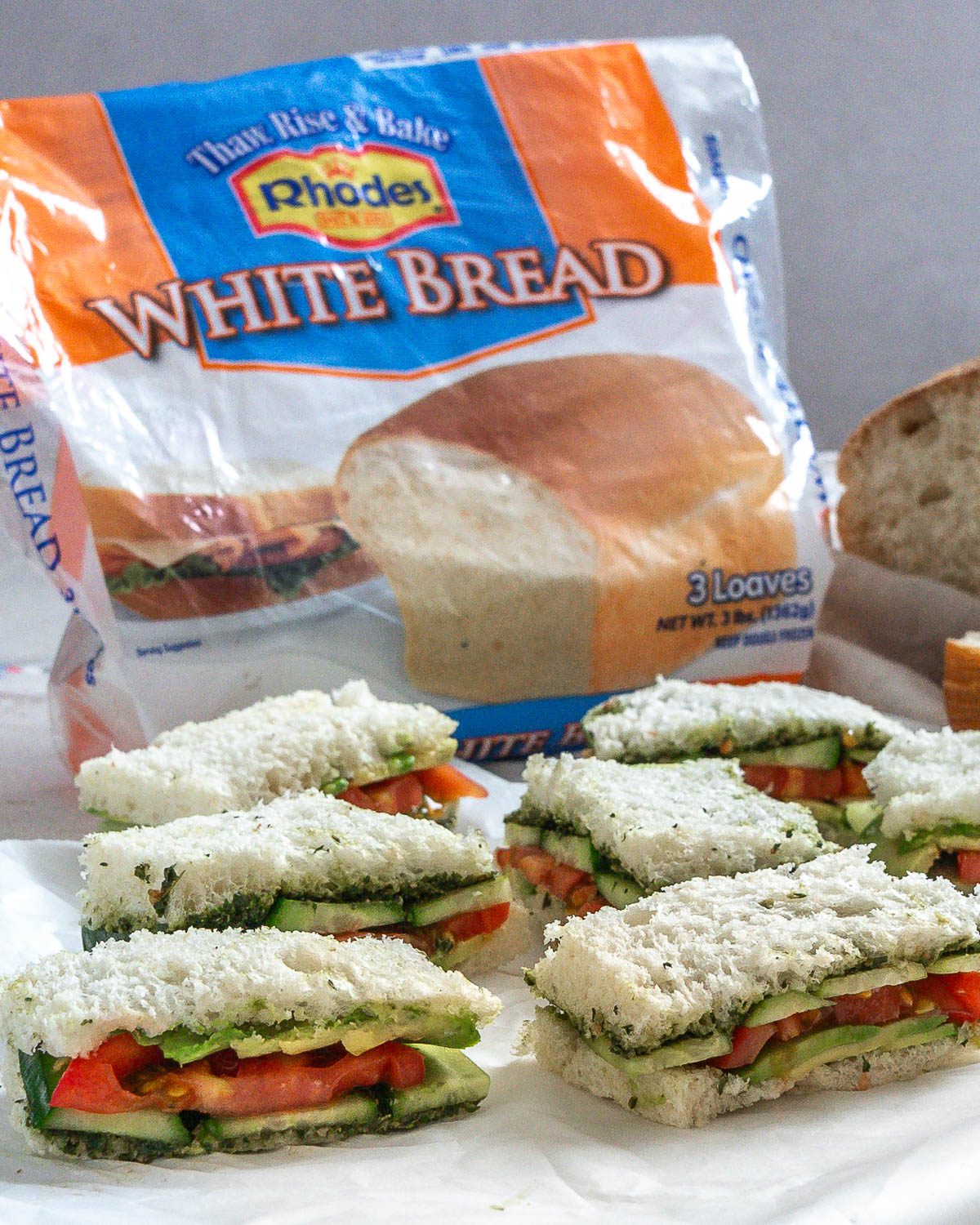completed Vegan Tea Sandwiches against white surface with rhodes packaging in background