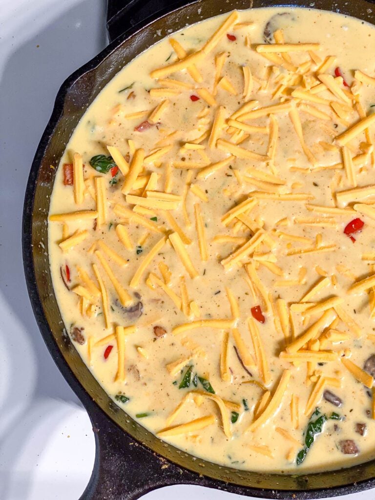 process shot of just egg frittata cooking in skillet