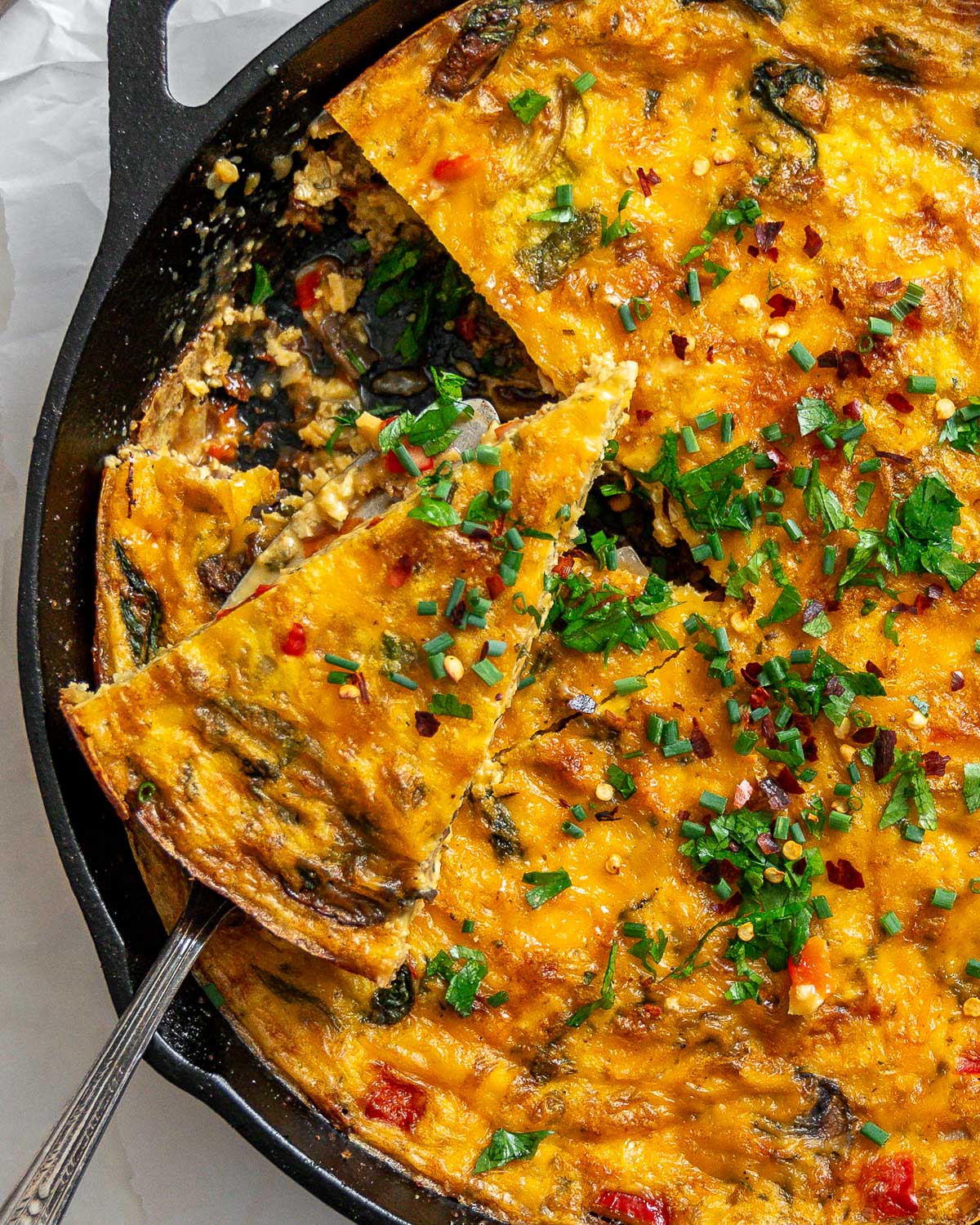 completed Vegan Just Egg Frittata in a skillet against a white surface