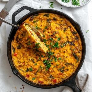 completed Vegan Just Egg Frittata in a skillet against a white surface