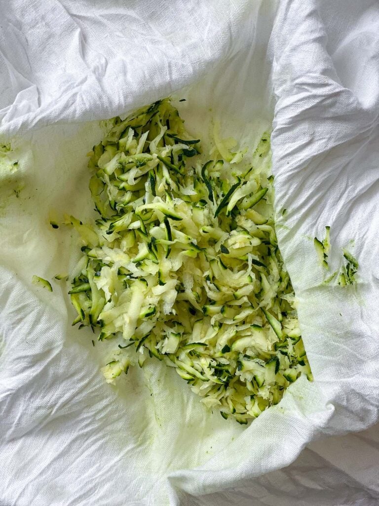 process shot showing process of removing moisture from zucchini