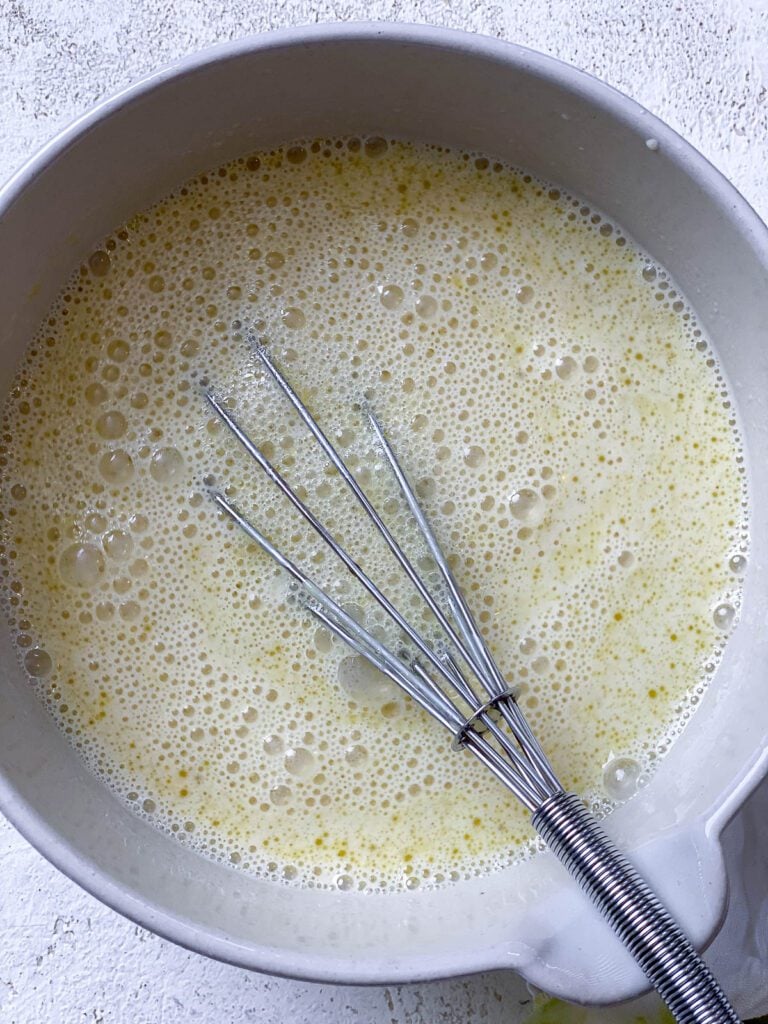 process shot of whisking ingredients in a bowl