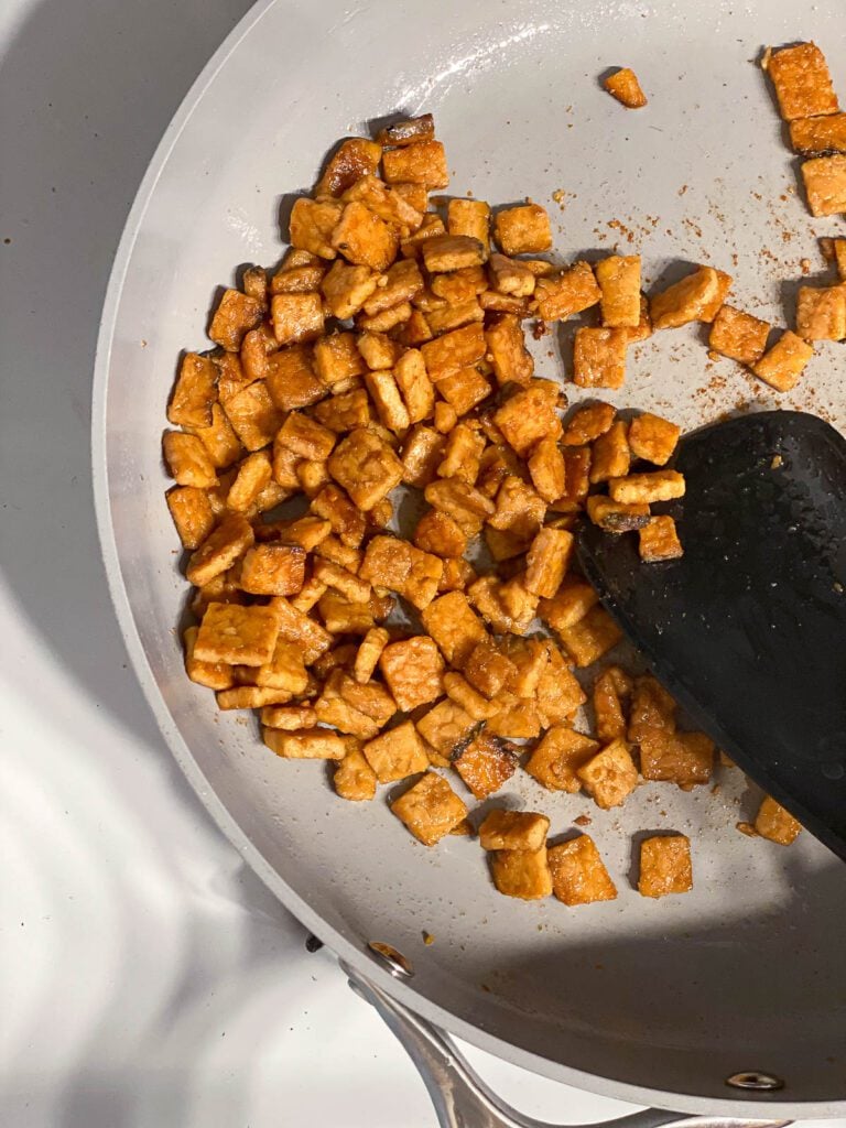 process shot of cooking tempeh in a pan