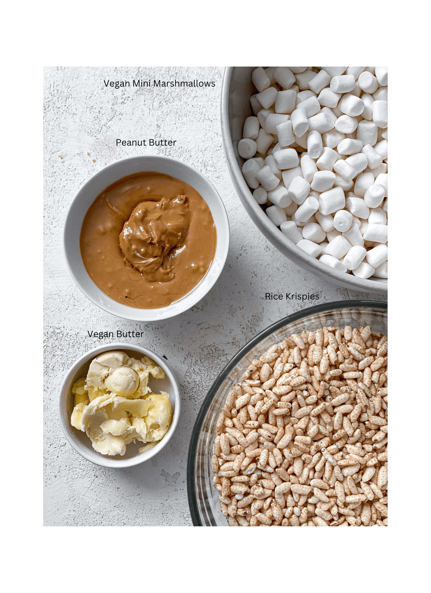ingredients for Easy Peanut Butter Rice Krispie Treats measured out against a white surface