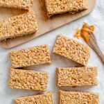 several completed Peanut Butter Rice Krispie Treats against a white surface