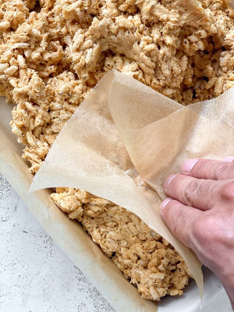 process shot of flattening mixture in baking dish