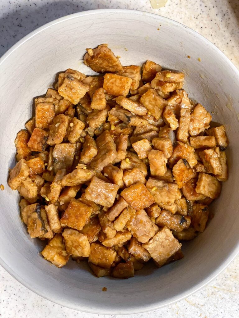 tofu added to a bowl