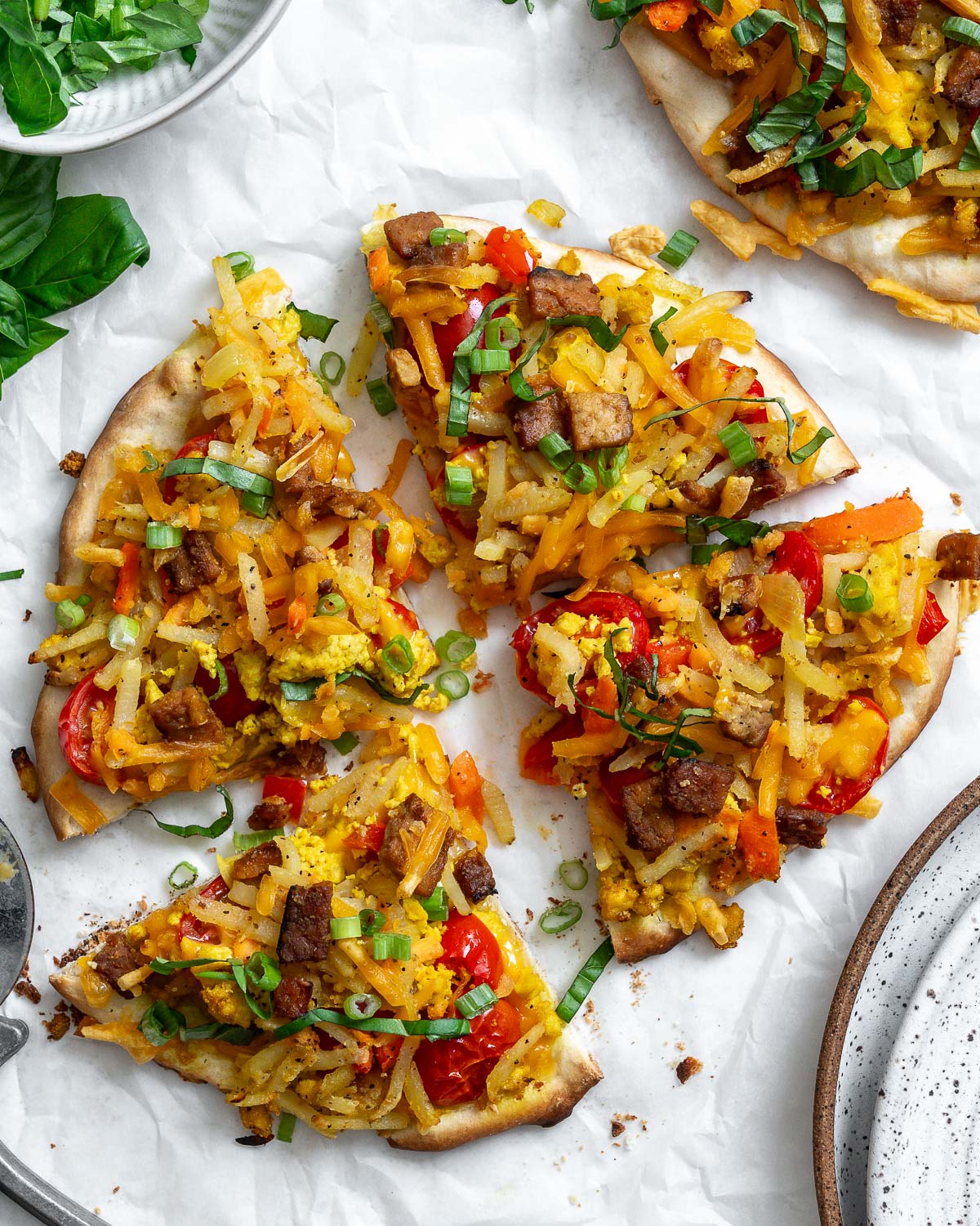 vegan breakfast pizza against a white surface