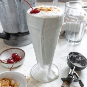 completed Coconut Shake in a cup against a white surface