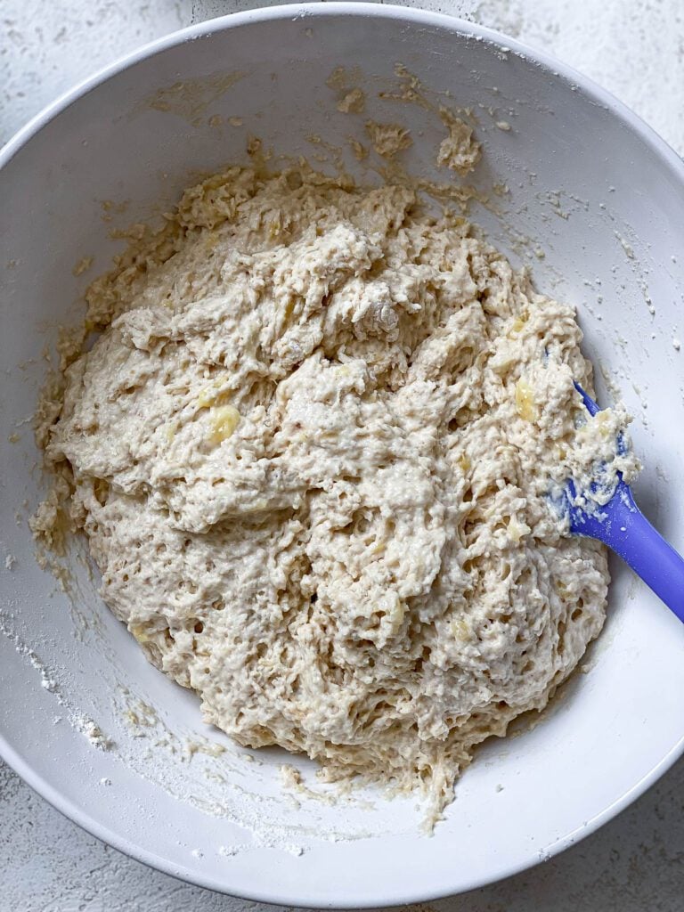 process shot of mixing ingredients together in a bowl