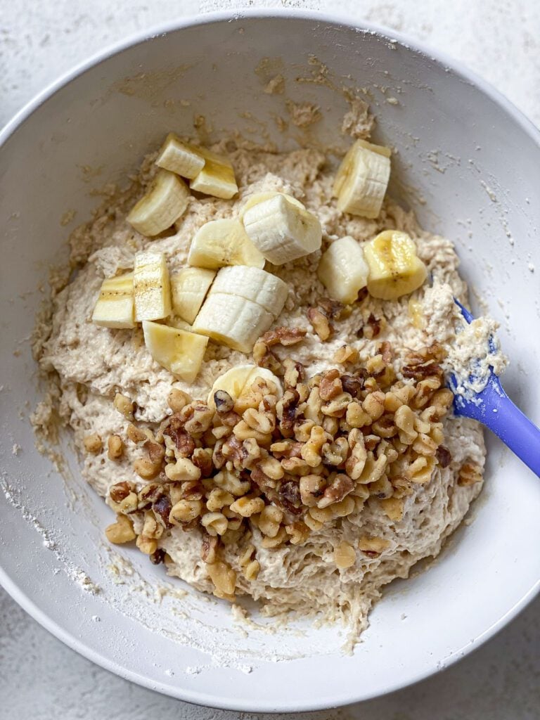 process shot of mixing ingredients together in a bowl