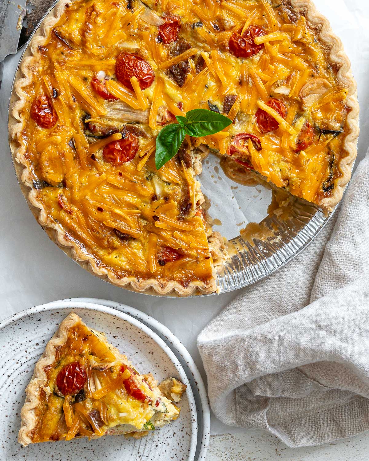 completed just egg quiche against a whtie surface