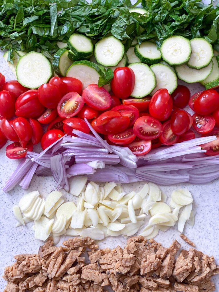 ingredients for Just Egg Quiche cut up on a cutting board