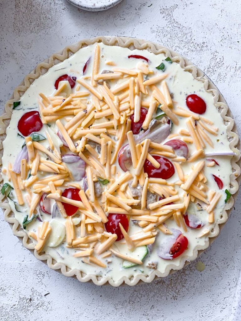 process shot of adding toppings to pie crust