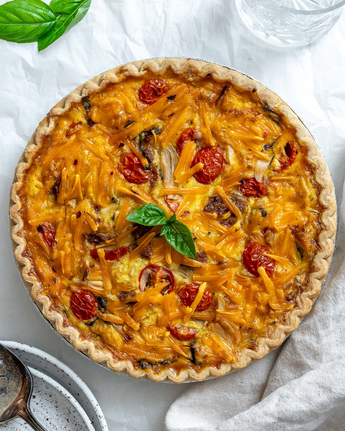 completed just egg quiche against a whtie surface