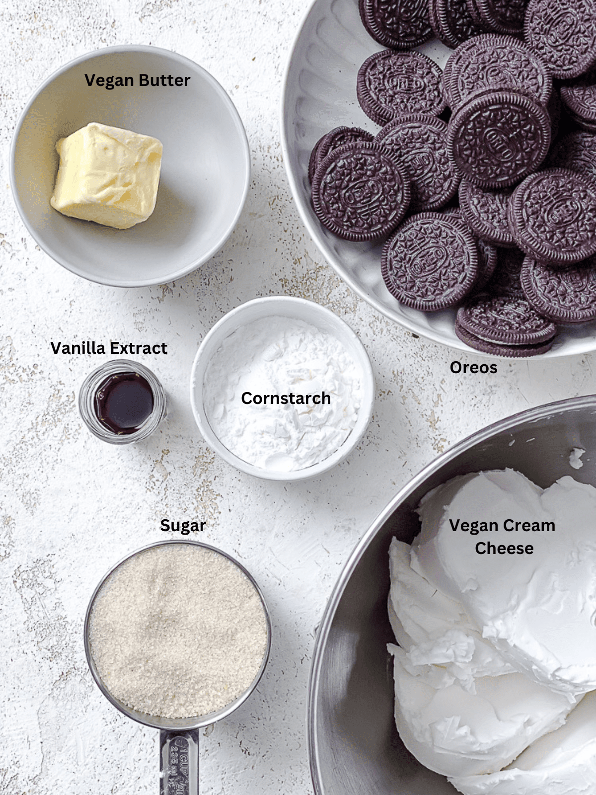 ingredients for Vegan Oreo Cheesecake [6 Ingredient] measured out on a white surface