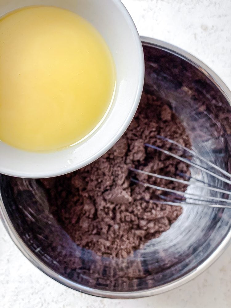 process shot of adding vegan butter to oreos