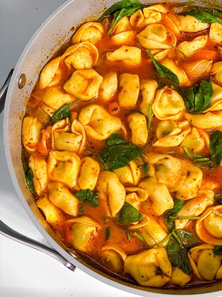 process shot of Vegan Tortellini Soup cooking in pot
