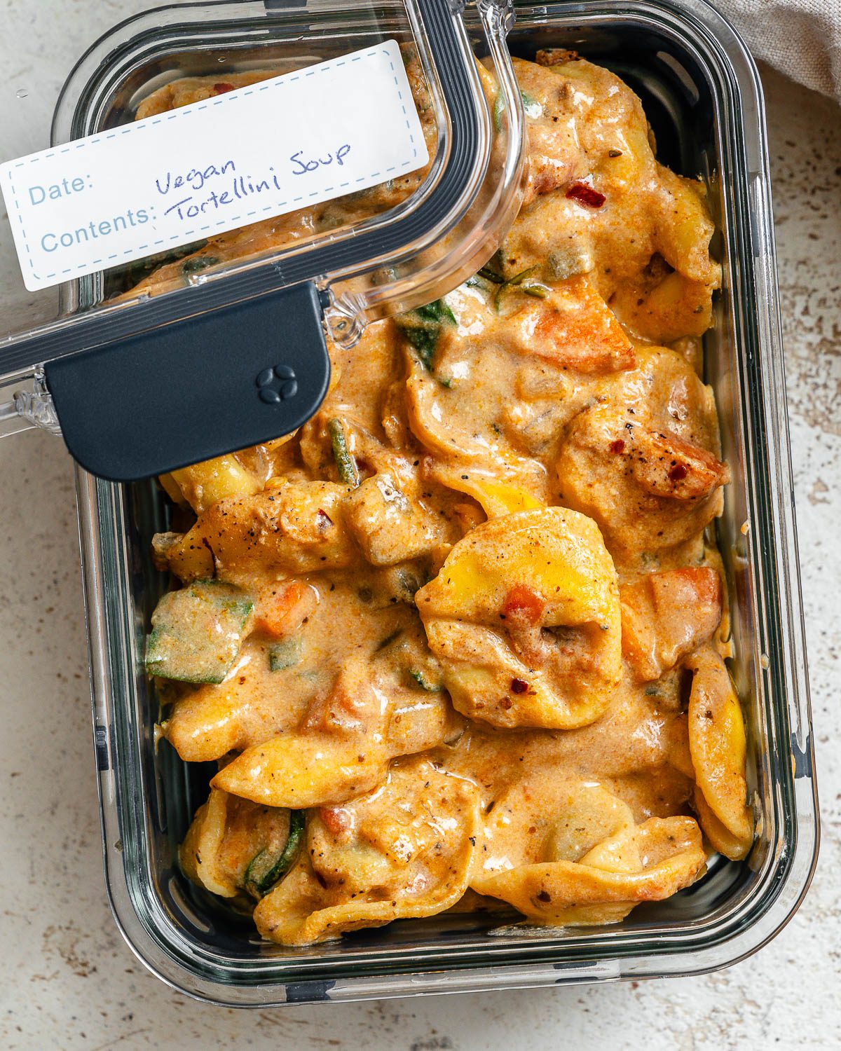completed Vegan Tortellini Soup in a container