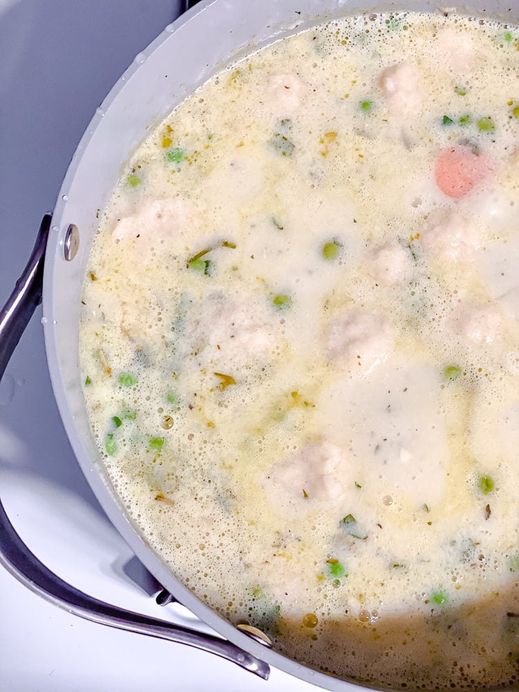 process shot showing balls of dough in pot