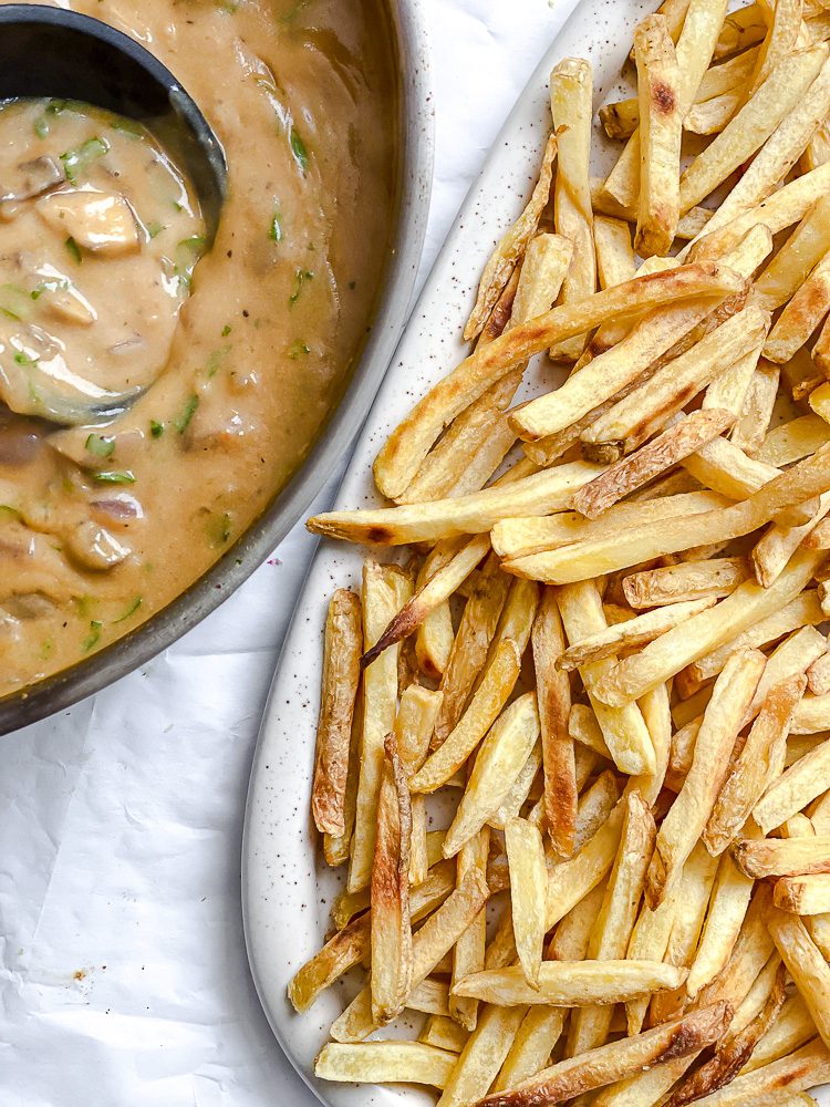 process shot showing fries and gravy alongside each other