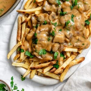 completed Vegan Poutine on a white platter