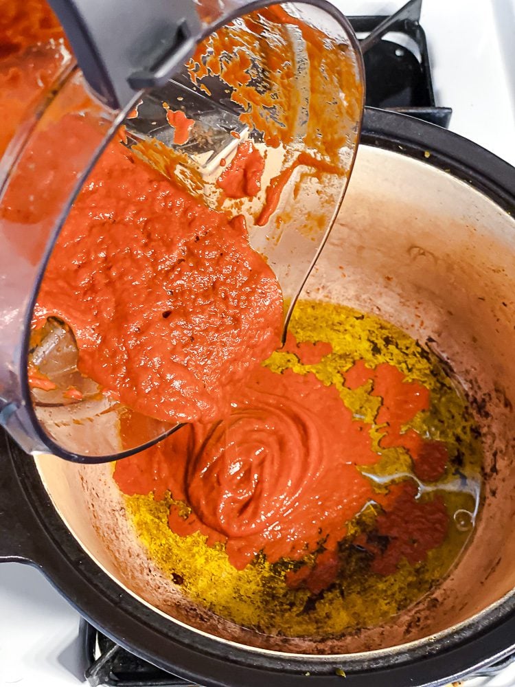 process shot showing blended ingredients added to pot
