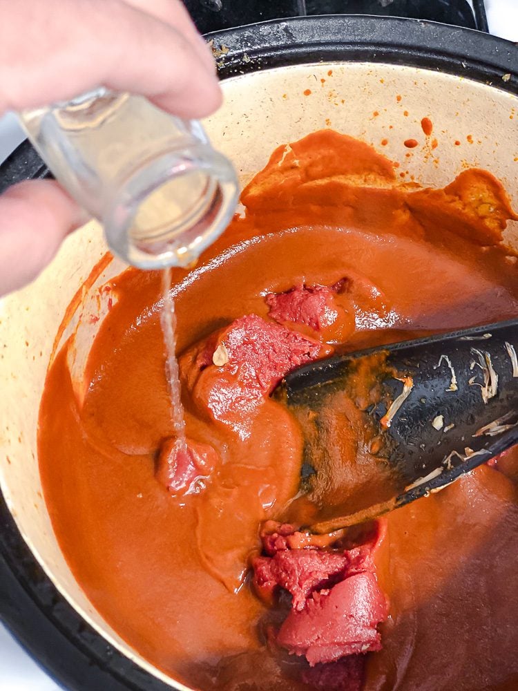 process shot showing oil being added to pot