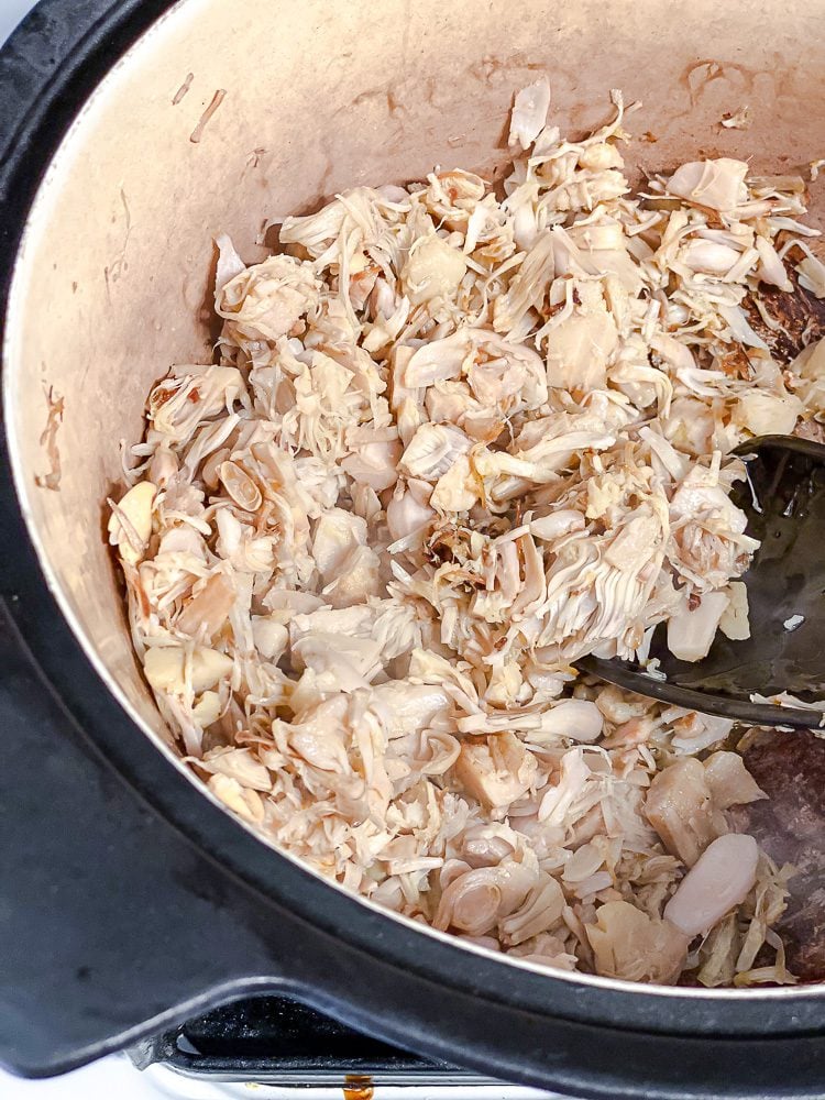 process shot showing jackfruit cooking in a bowl