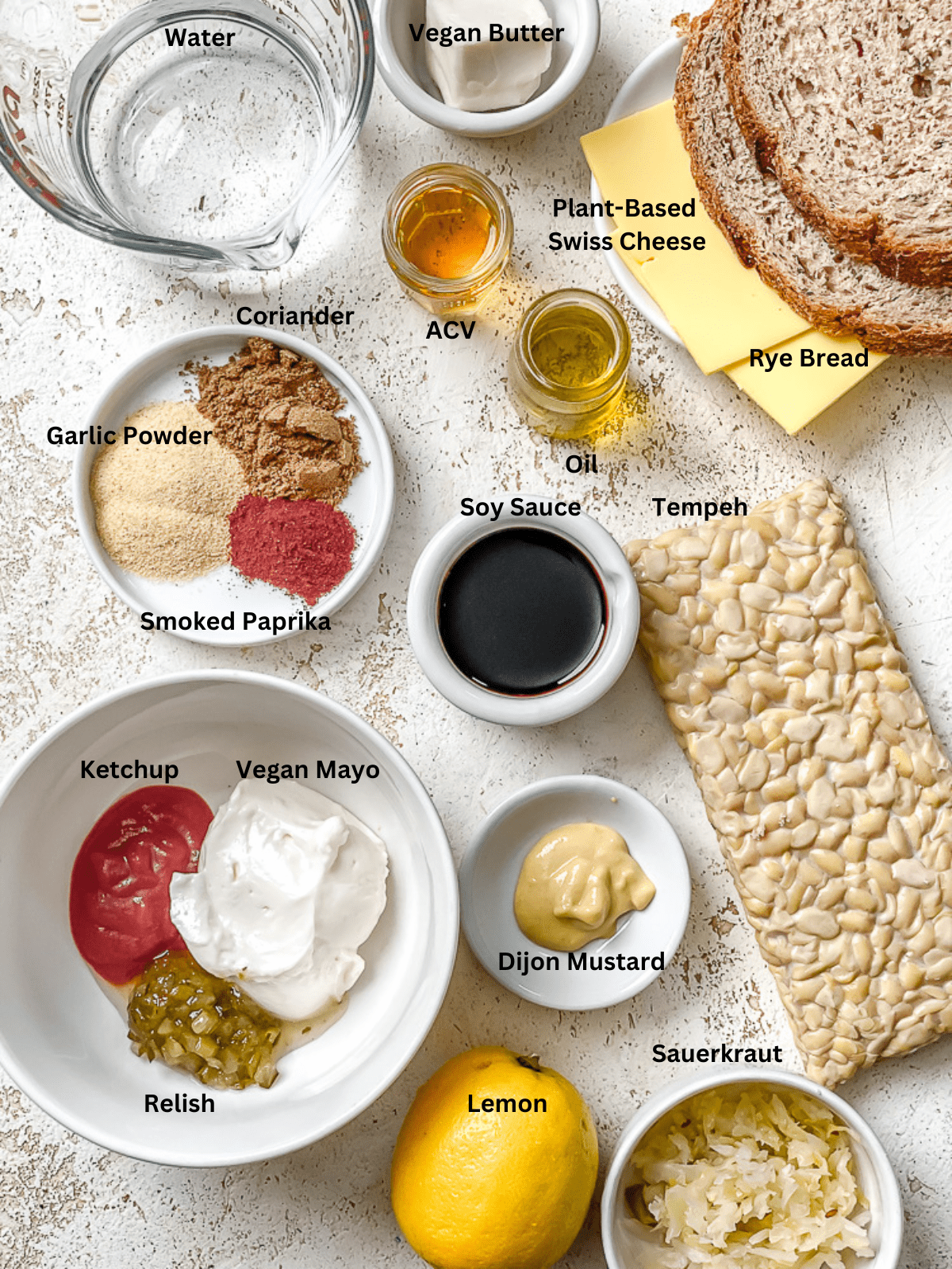 ingredients for Vegan Reuben Sandwich measured out on a white surface