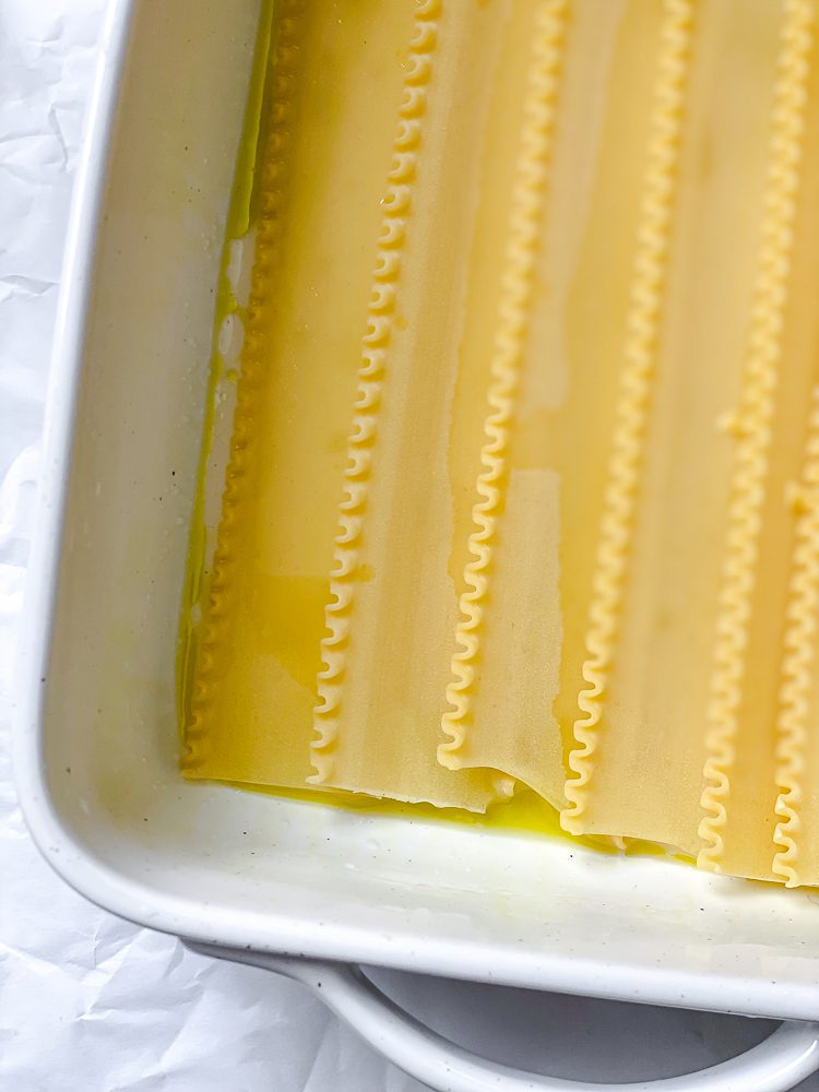 process shot showing lasagna noodles in baking dish