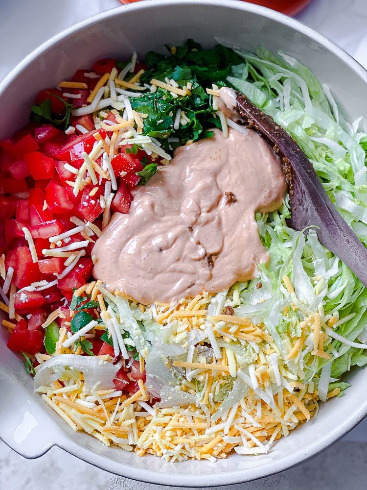 process shot of mixing ingredients together in bowl