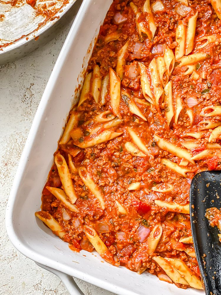process shot showing pasta added to baking dish