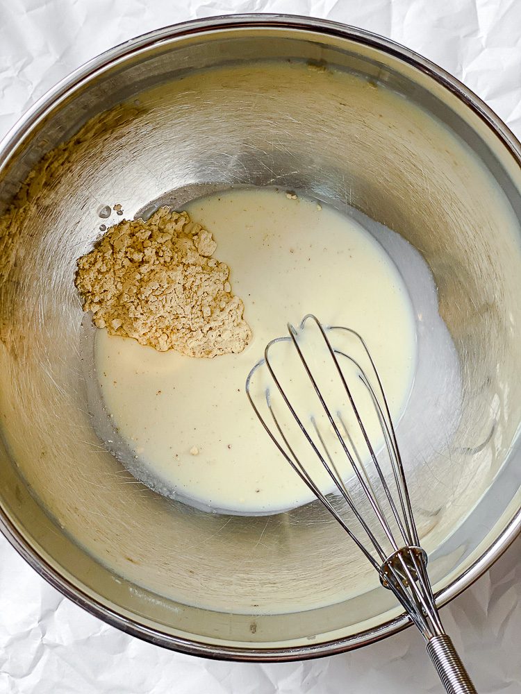 process shot of whisking ingredients in bowl