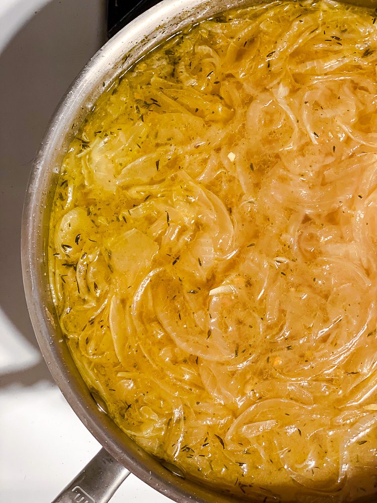 process shot showing soup cooking in pot