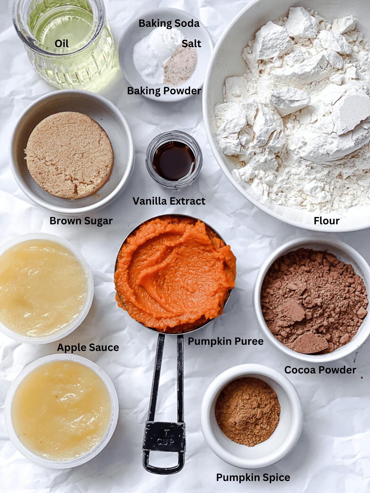 ingredients for Pumpkin Whoopie Pies measured out on a white surface