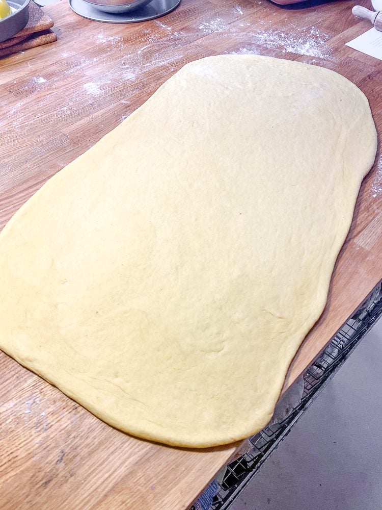 process shot showing flattened out dough