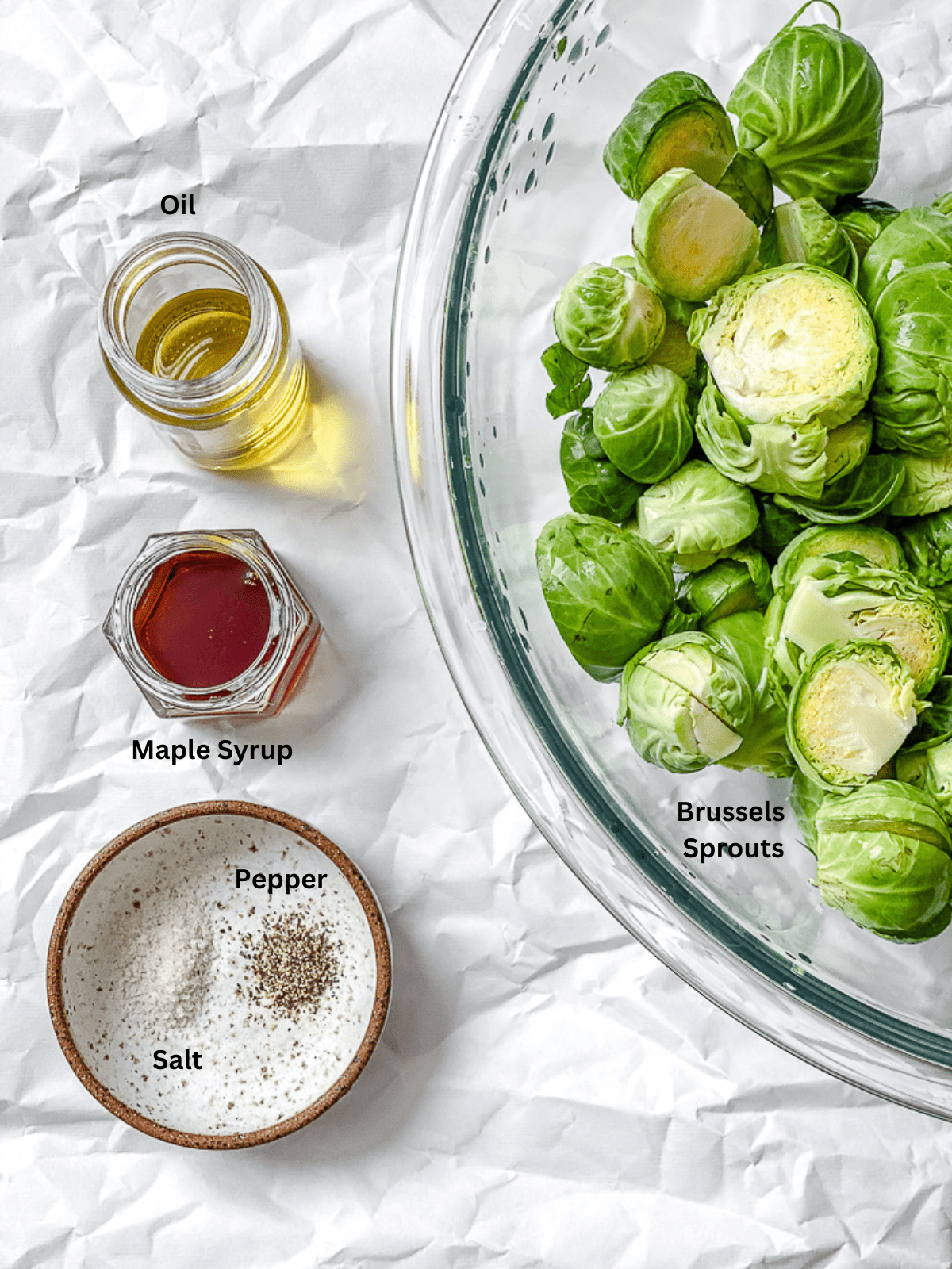 ingredients for Maple Glazed Brussel Sprouts measured out against a white surface