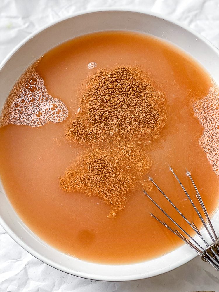 process shot of mixing liquid in bowl