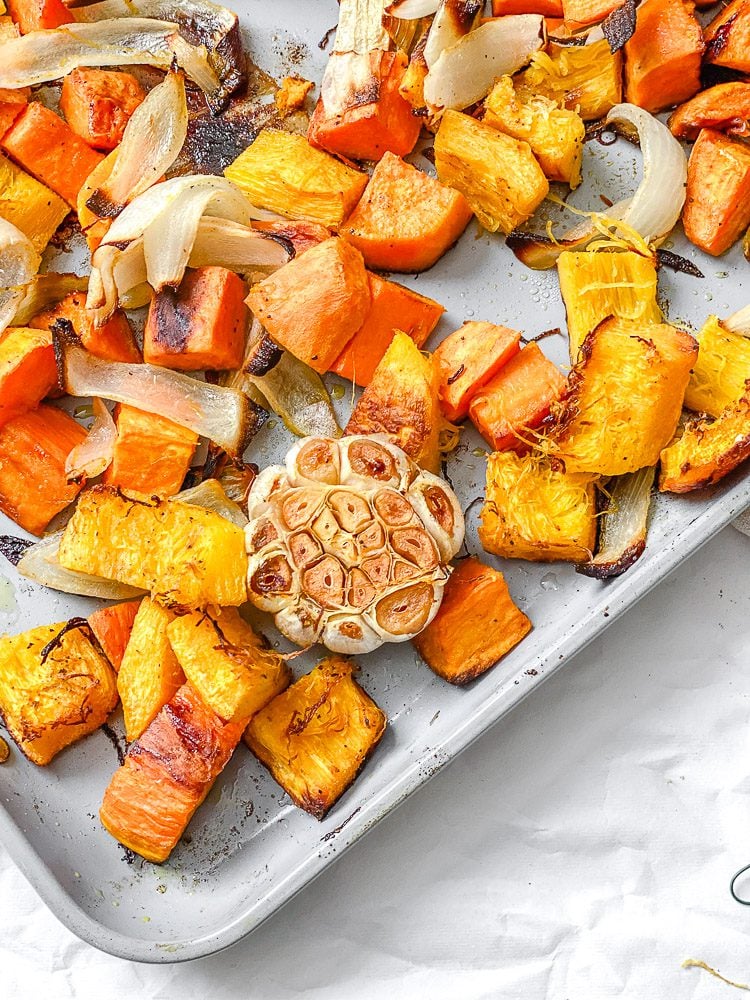 process shot showing post baked veggies in baking pan