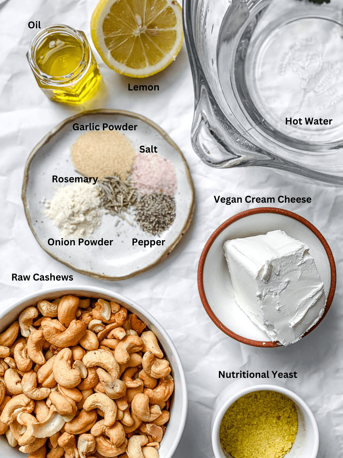 ingredients for Vegan Cheese Ball measured out on a white surface
