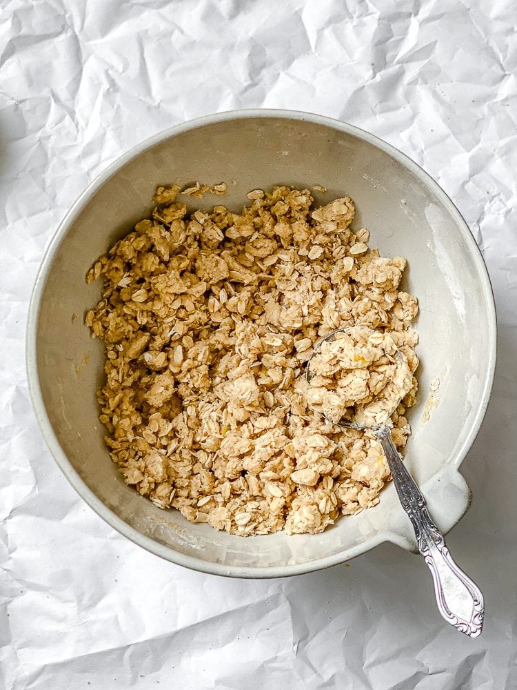 process shot showing crumble mixture in bowl