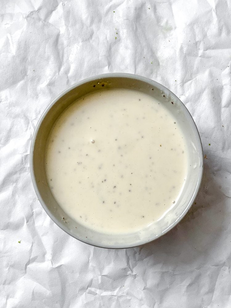 process shot showing dressing in a bowl