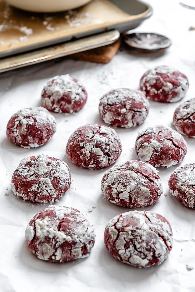 completed Red Velvet Crinkle Cookies on a white surface
