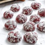 completed Red Velvet Crinkle Cookies on a white surface
