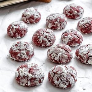 completed Red Velvet Crinkle Cookies on a white surface
