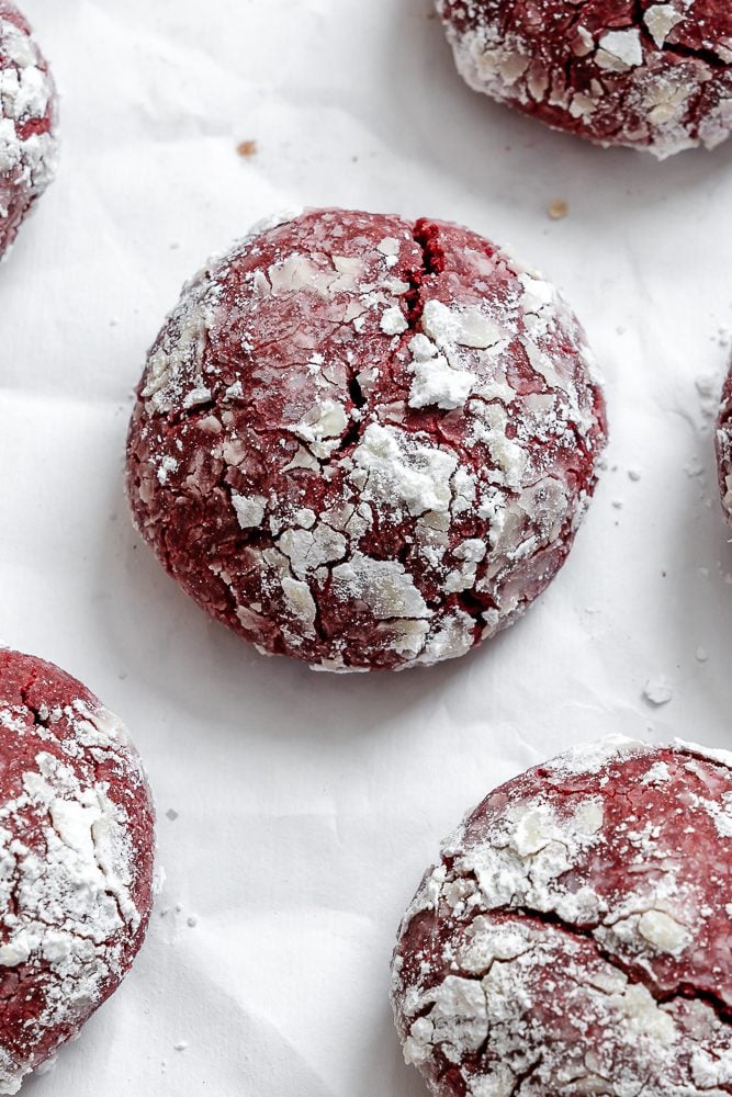 completed Red Velvet Crinkle Cookies on a white surface