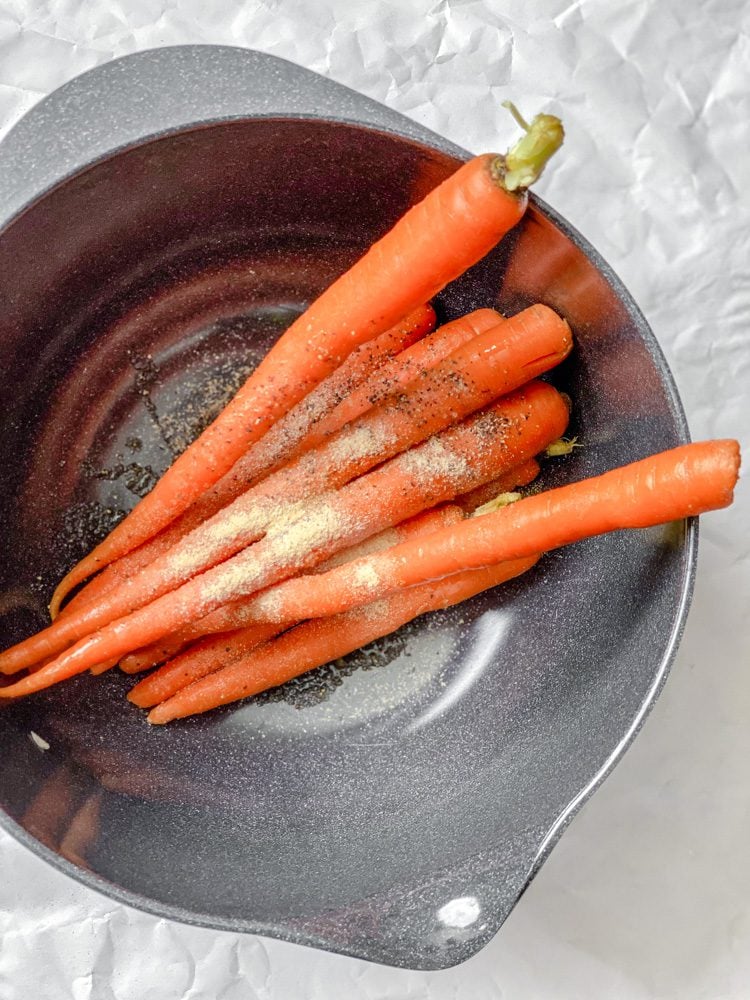 process shot showing carrots in a bowl